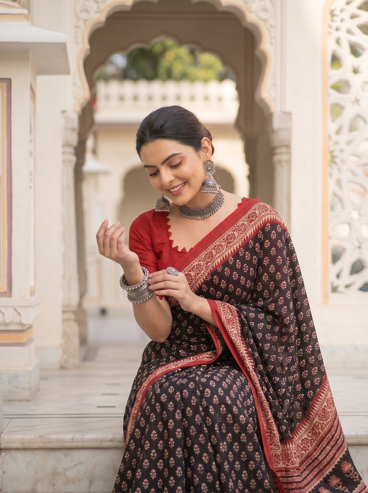 PREMIUM SOFT ART SILK SAREE WITH TRADITIONAL ALL-OVER BOOTI PRINT & CONTRAST WOVEN BORDER - BLACK & RED