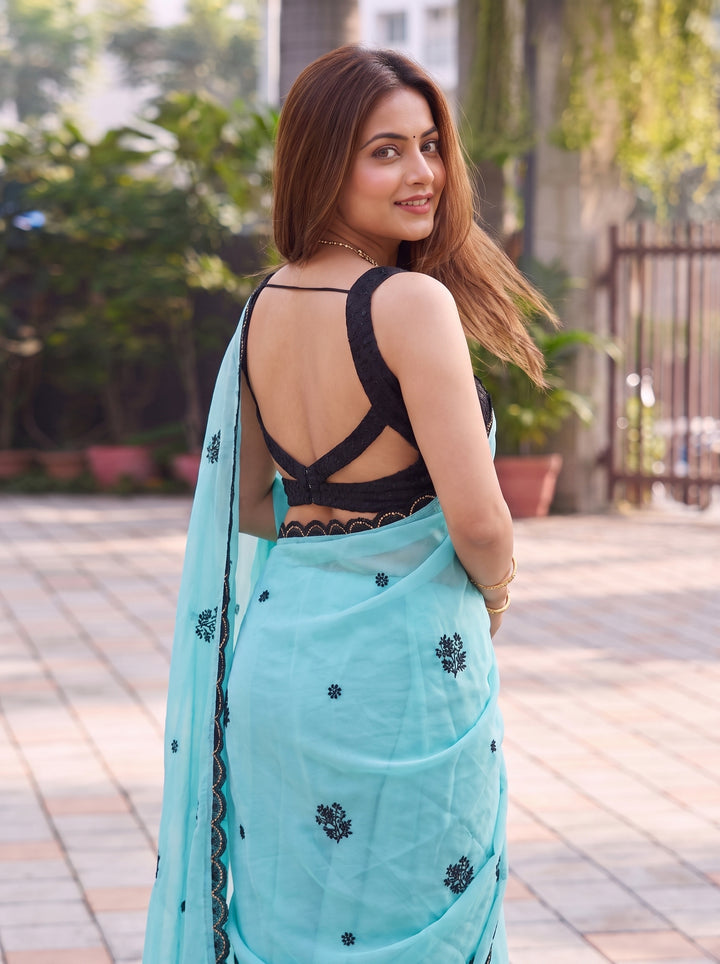 LIGHT BLUE PARTY WEAR SAREE WITH CONTRAST BLACK MOTIFS