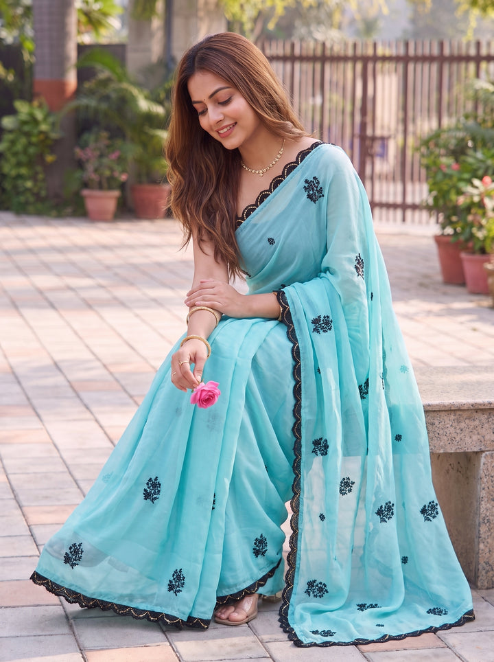 LIGHT BLUE PARTY WEAR SAREE WITH CONTRAST BLACK MOTIFS