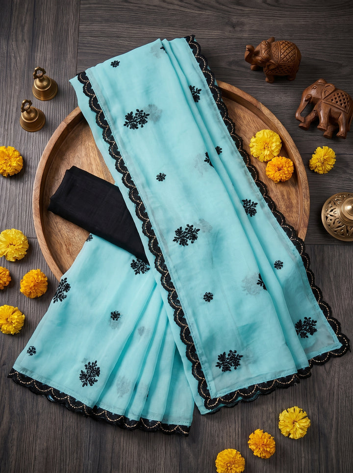 LIGHT BLUE PARTY WEAR SAREE WITH CONTRAST BLACK MOTIFS