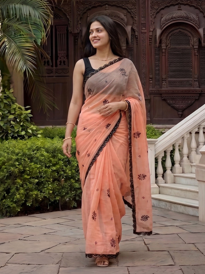 PEACH GEORGETTE SAREE WITH BLACK SCALLOPED BORDER
