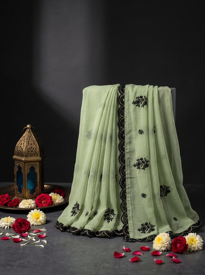 PASTEL GREEN DESIGNER SAREE WITH BLACK THREADWORK LACE